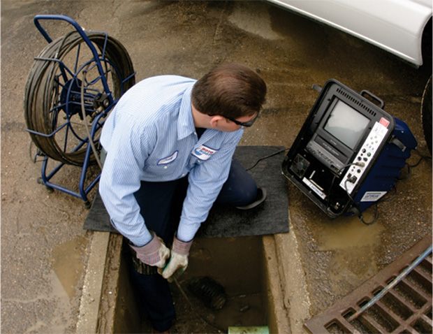 Sewer camera monitor showing the inside of a line