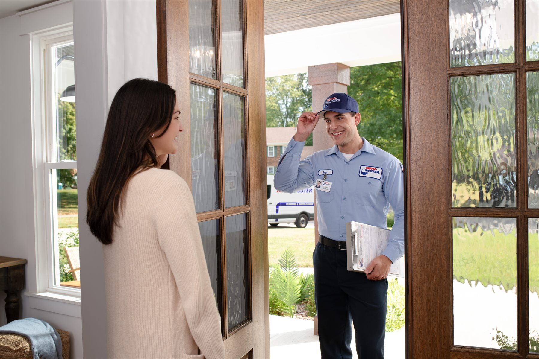 Roto-Rooter technician arriving at a Ammon home with the service van
