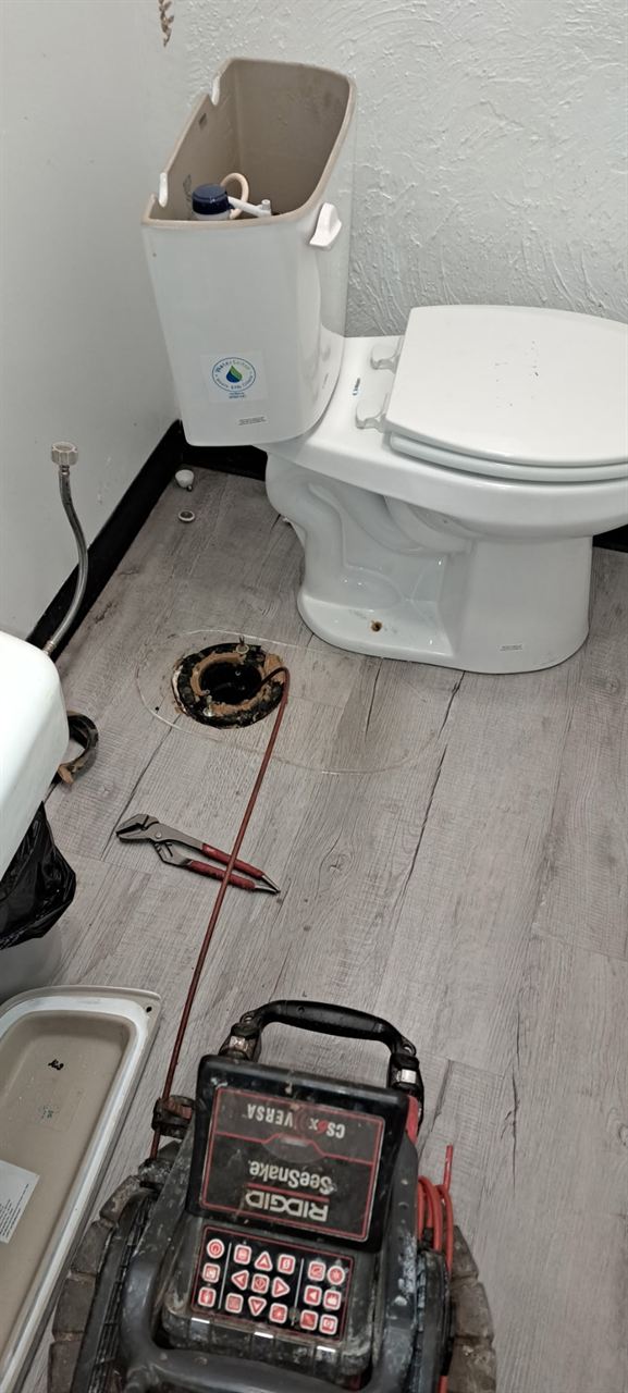 Toilet pulled and a sewer camera run down the line